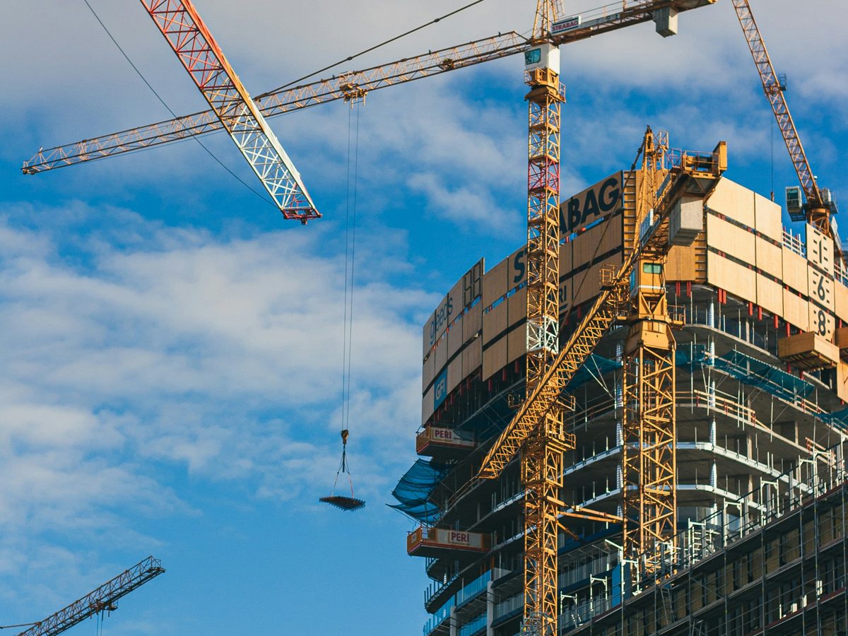 High-rise construction site with tower cranes